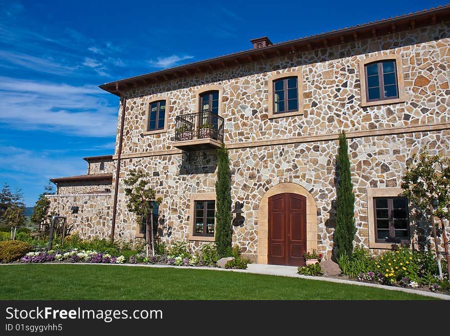 Impressive Napa Valley winery under blue skies, California.