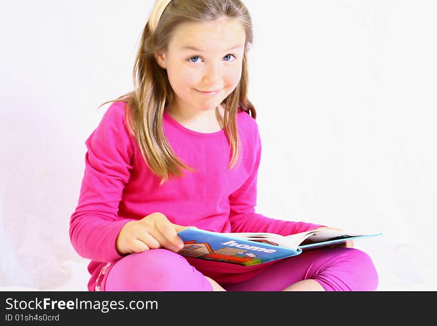 Young cute girl with book.