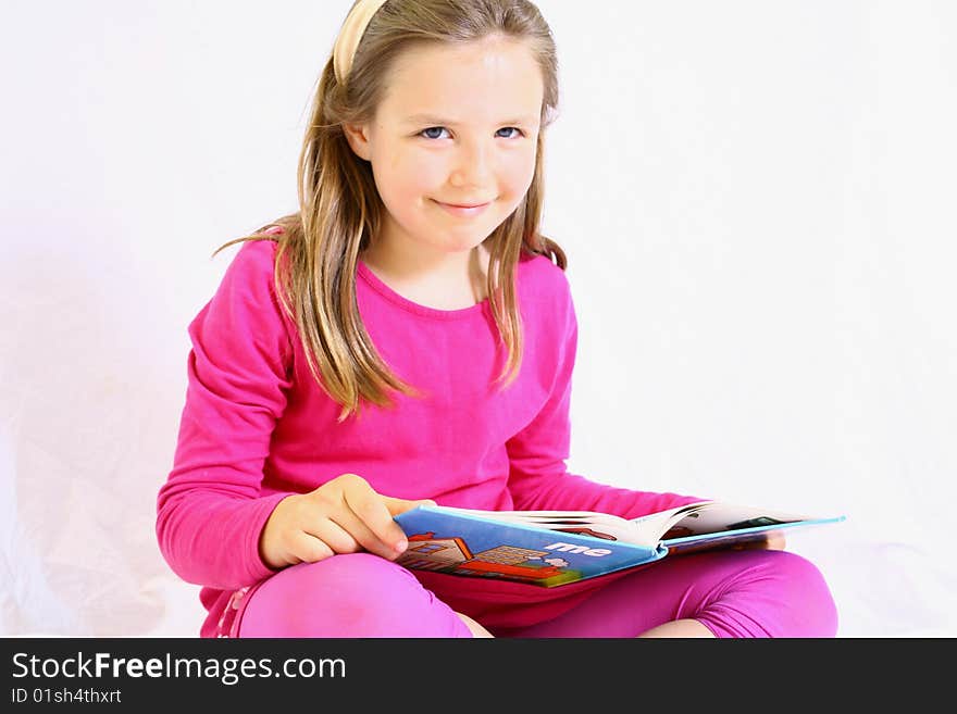 Young Cute Girl With Book.