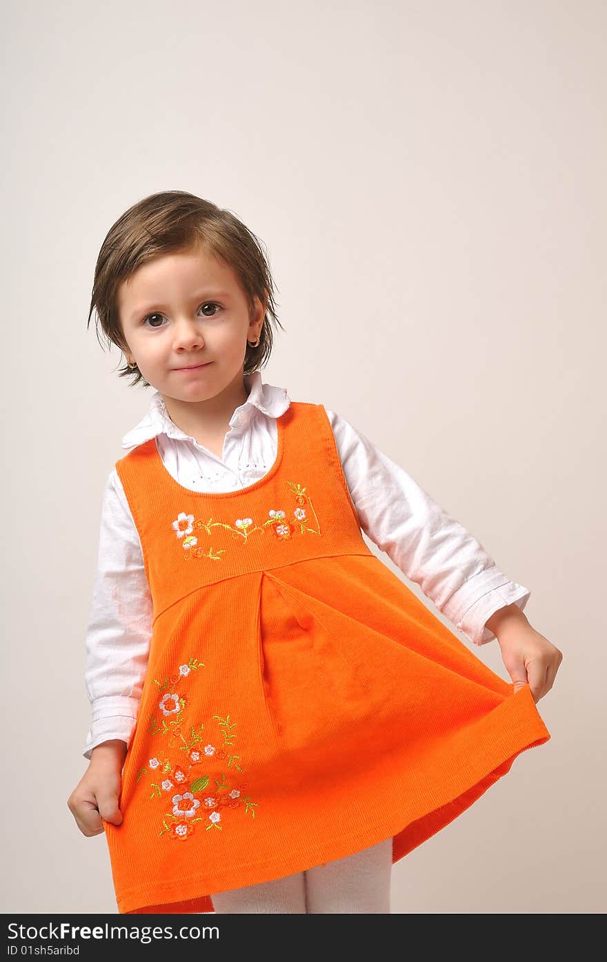 Portrait of pretty girl with orange dress. Portrait of pretty girl with orange dress