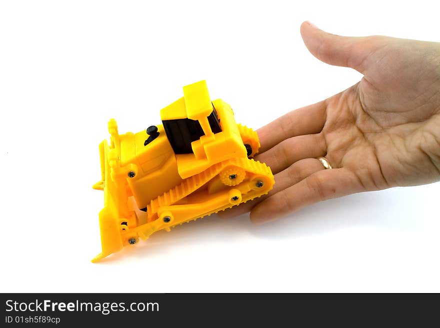 Hand and tractor on white background