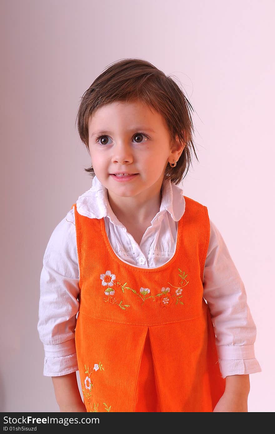 Portrait of pretty girl with orange dress. Portrait of pretty girl with orange dress