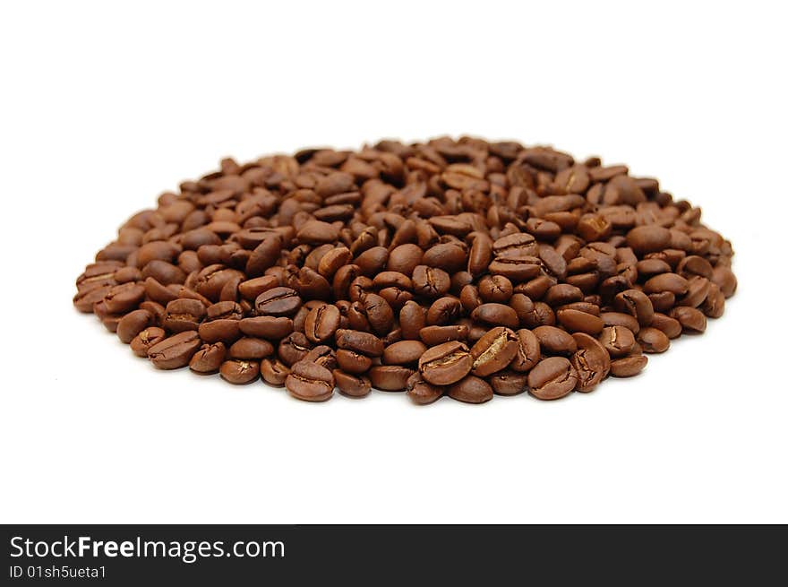 Hill of coffee grains over white