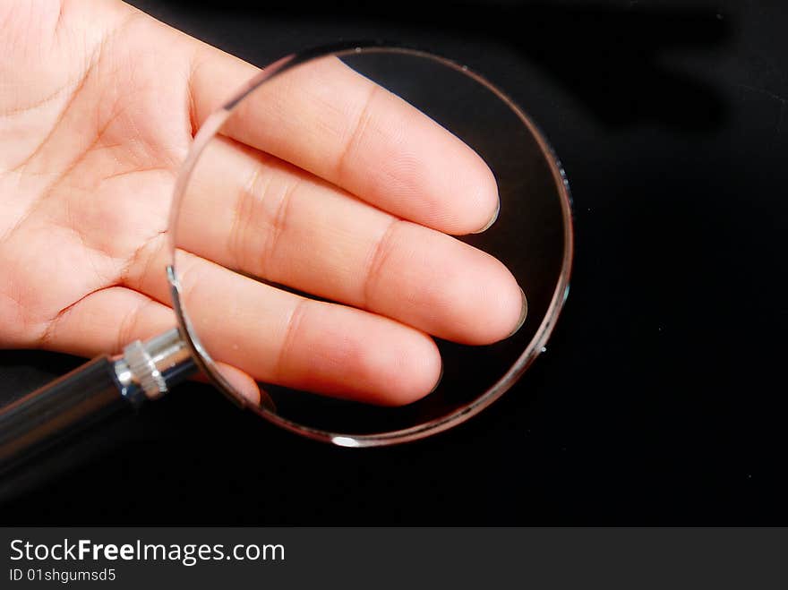 Enlarge human finger with Magnifier Glass. Enlarge human finger with Magnifier Glass