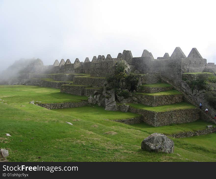 Machu Picchu huts under the fog, Andes, Perù, South America