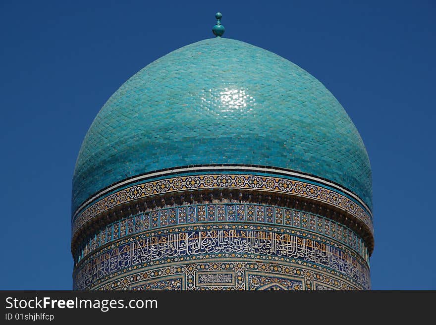 Architectural details of Kalyan Mosque dome with blue sky background, Buchara silk road, Uzbekistan. Architectural details of Kalyan Mosque dome with blue sky background, Buchara silk road, Uzbekistan.