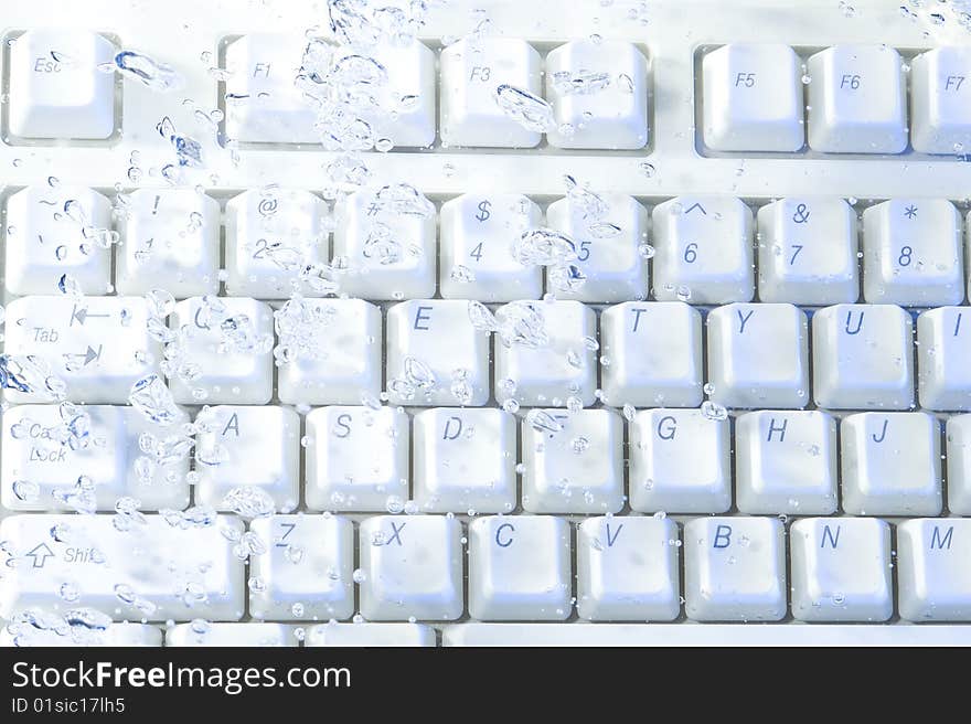 Creative keyboard with bubbles water. Computer background