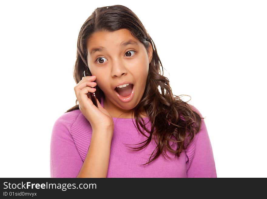 Shocked Pretty Hispanic Girl On Cell Phone Isolated on a White Background.