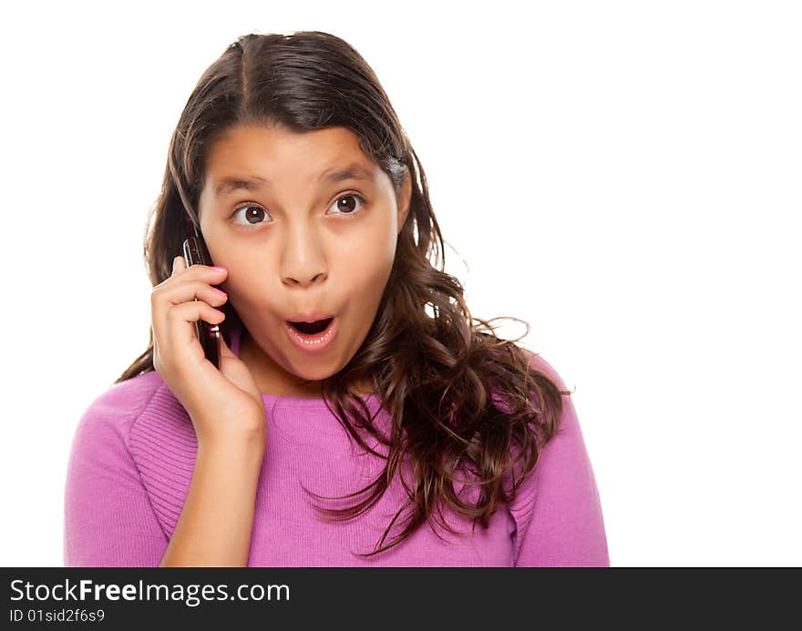 Shocked Pretty Hispanic Girl On Cell Phone Isolated on a White Background.