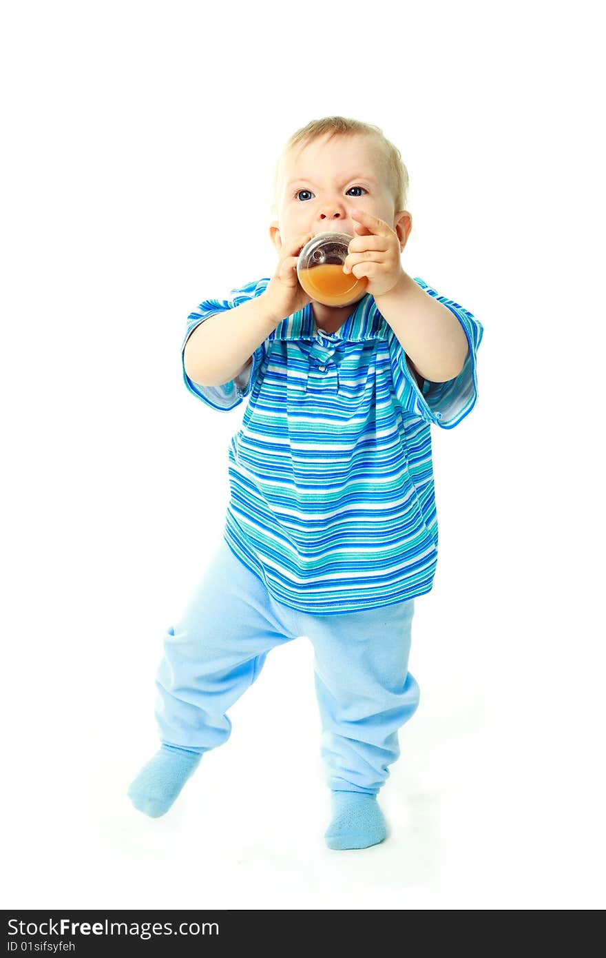 Portrait of a cute baby drinking juice