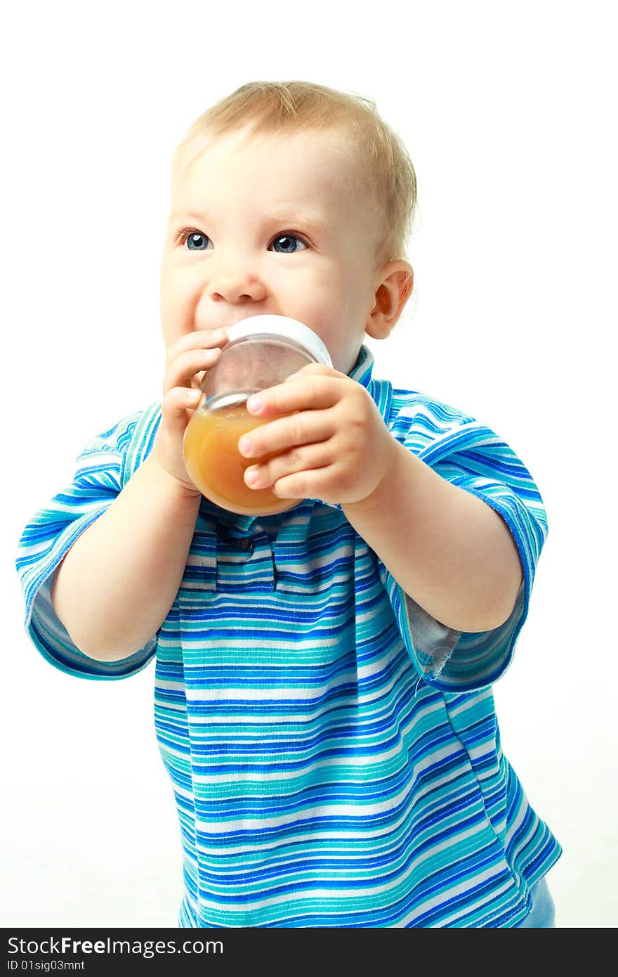 Portrait of a cute baby drinking juice