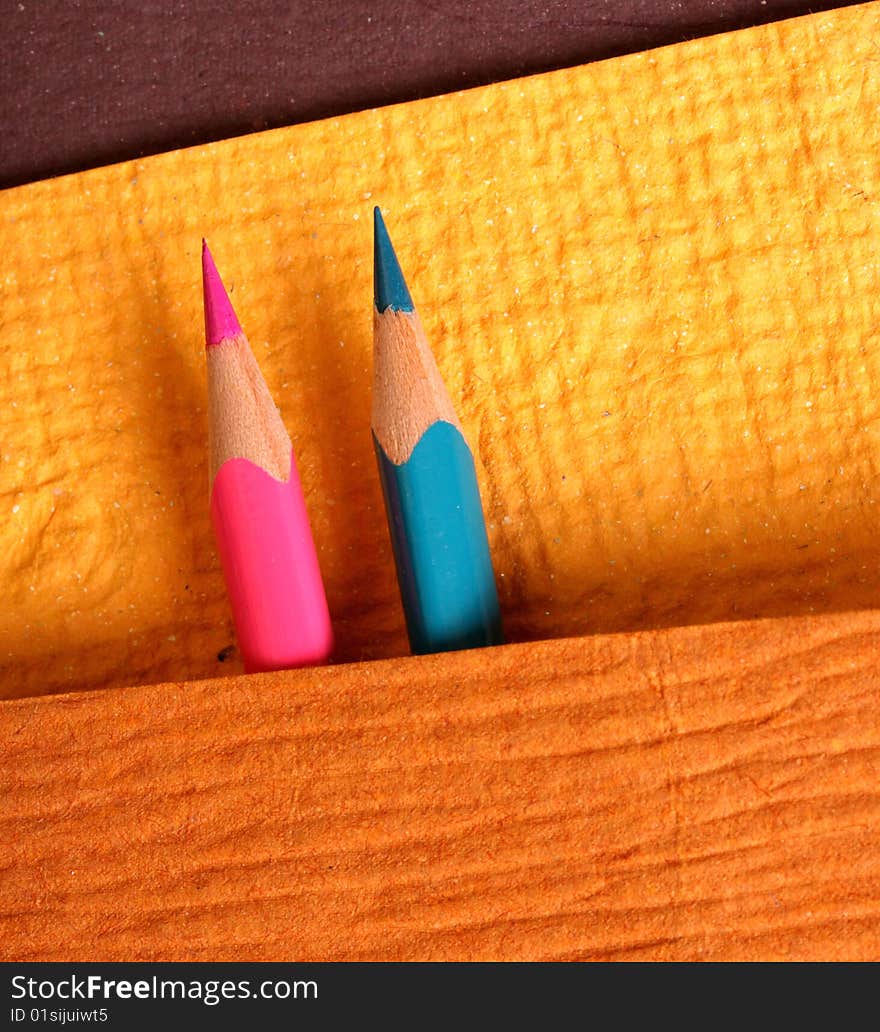 Multicolored pencils with handmade paper