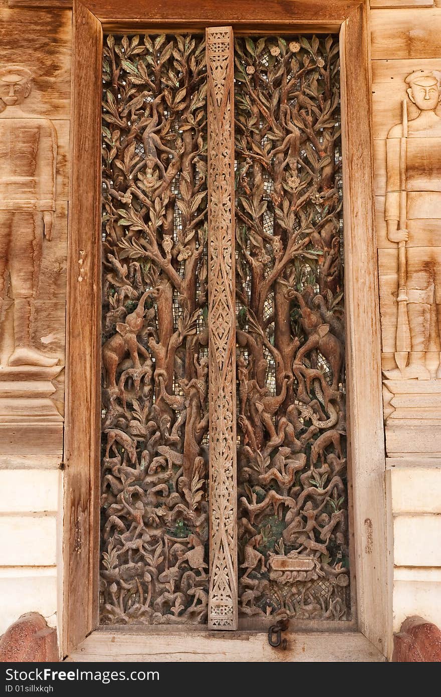 Door of teak wood church, Wat Kut Ti, Petchaburi province, Thailand. Door of teak wood church, Wat Kut Ti, Petchaburi province, Thailand