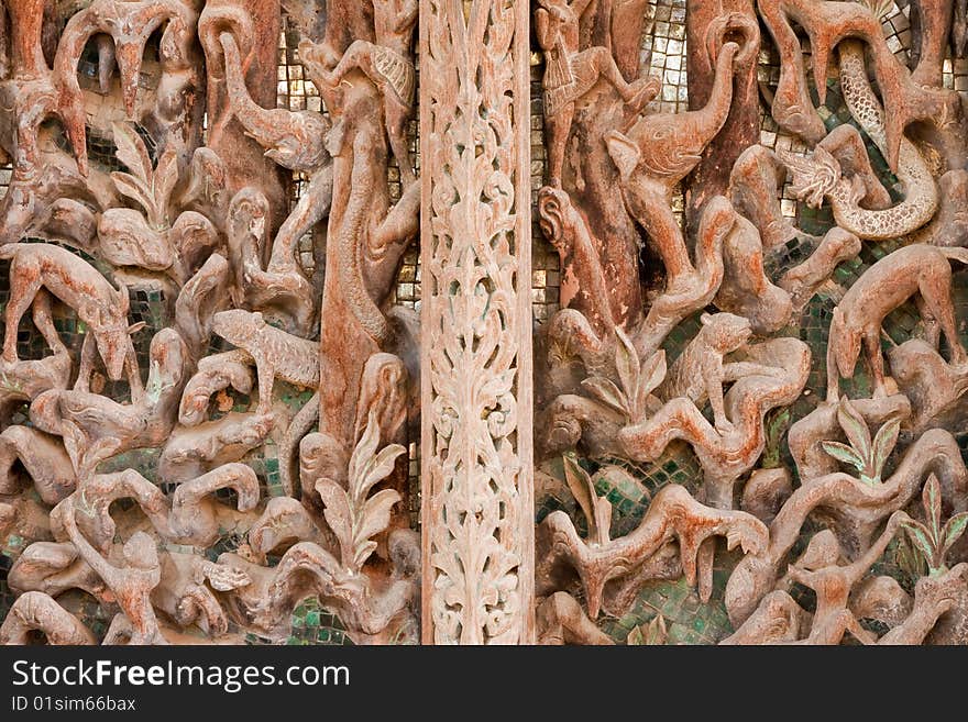 Door of teak wood church, Wat Kut Ti, Petchaburi province, Thailand. Door of teak wood church, Wat Kut Ti, Petchaburi province, Thailand