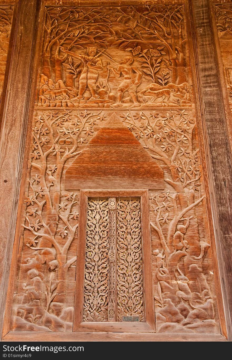 Door of teak wood church, Wat Kut Ti, Petchaburi province, Thailand. Door of teak wood church, Wat Kut Ti, Petchaburi province, Thailand