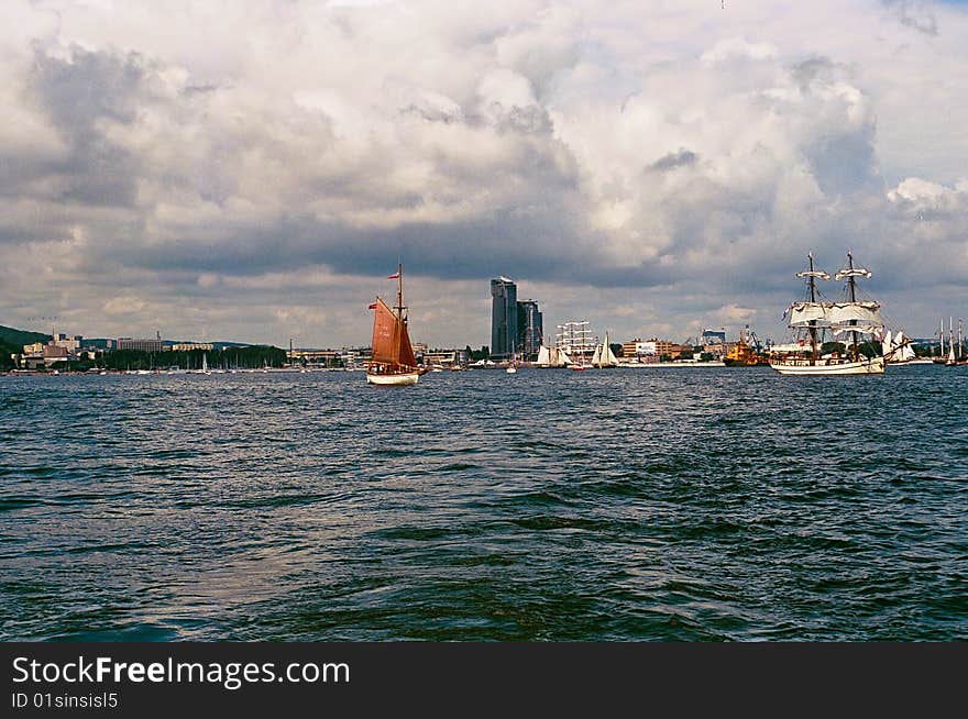 Image taken on official parade on Tall Ships' Races 2009 in Gdynia, Poland, 2-5 of July 2009. View on Se Towers and boats taking part in the parade. Image taken on official parade on Tall Ships' Races 2009 in Gdynia, Poland, 2-5 of July 2009. View on Se Towers and boats taking part in the parade.