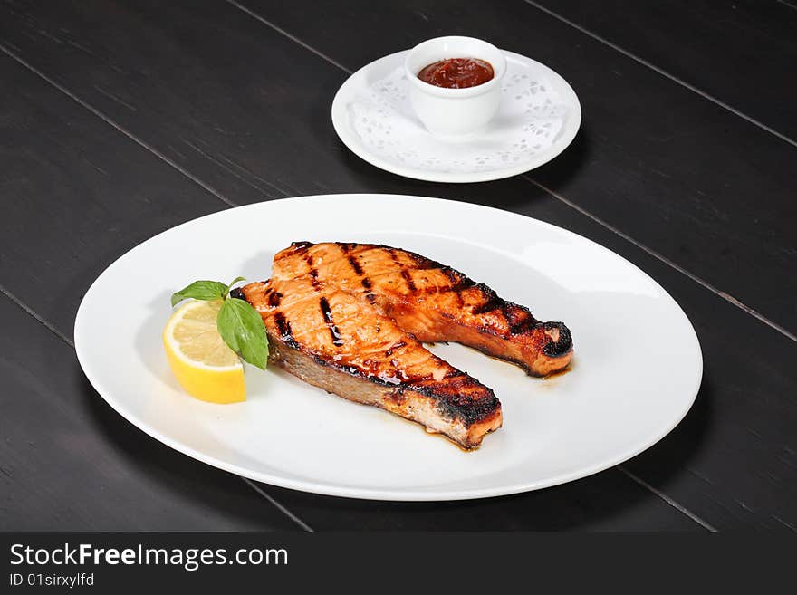 Grilled salmon on the white plate