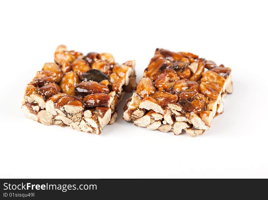 Cereal bars with almods and honey on a white background