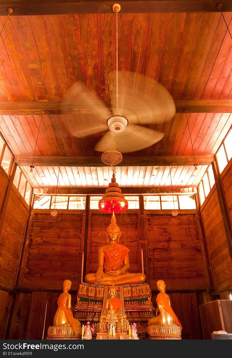 Buddha image in teak wood church