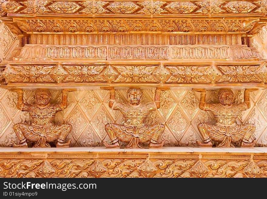 Giants on base of pagoda, Wat Kut Ti, Petchaburi province, Thailand. Giants on base of pagoda, Wat Kut Ti, Petchaburi province, Thailand