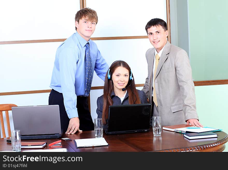 Business theme: business people in a work process in office. Business theme: business people in a work process in office.