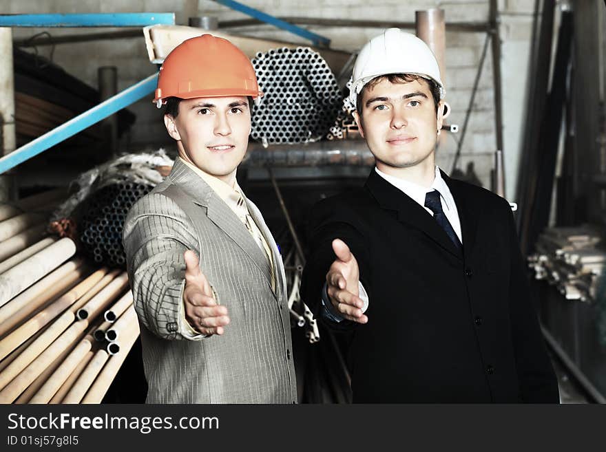 Industrial theme: two blue collars at a manufacturing area. Industrial theme: two blue collars at a manufacturing area.