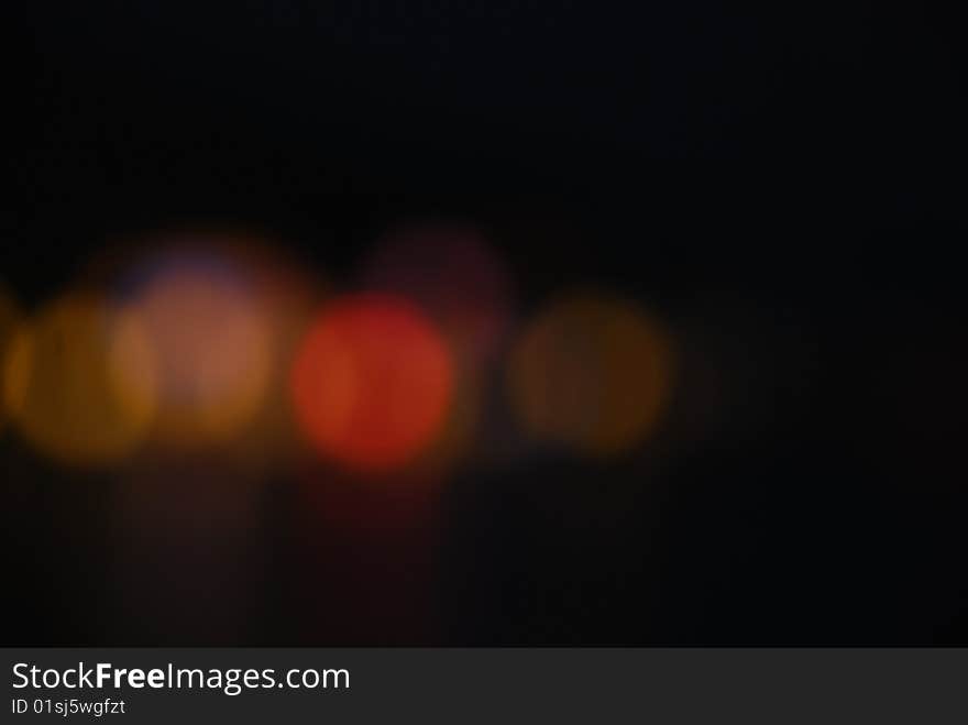 Out of focus tungsten marina bay lights forming a composition at night. Out of focus tungsten marina bay lights forming a composition at night