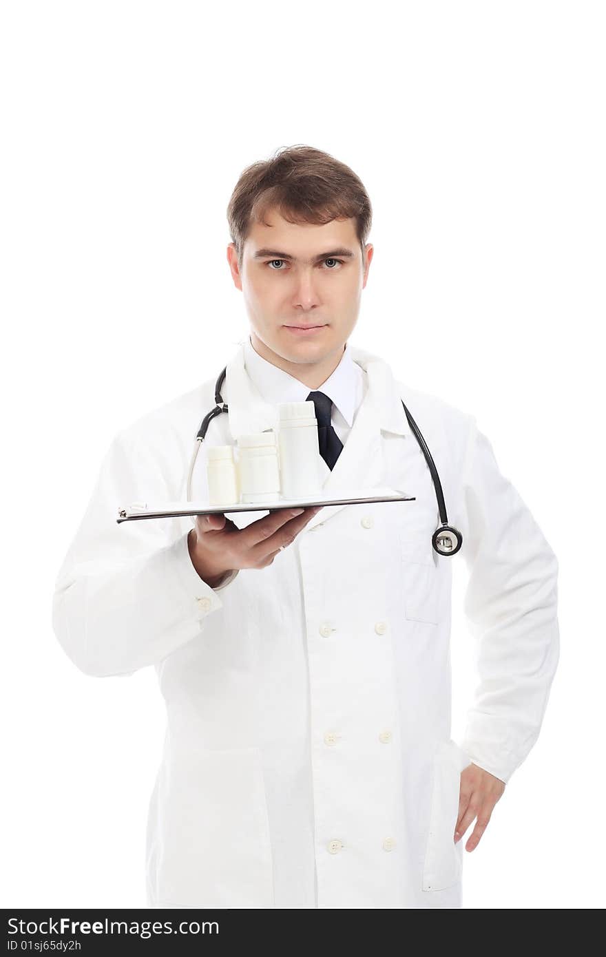 Medical theme: serious doctor holding pills.