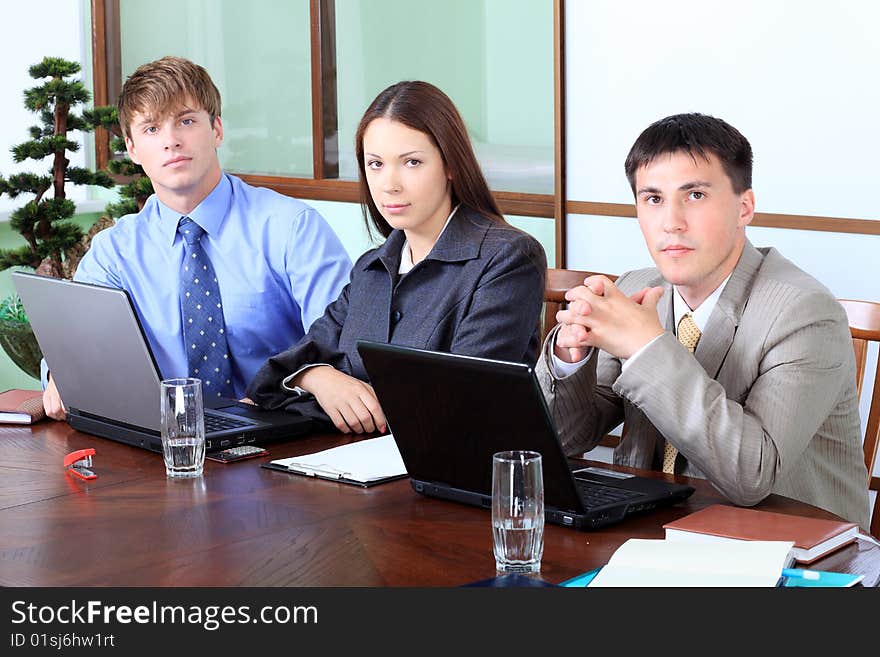 Business theme: business people in a work process in office. Business theme: business people in a work process in office.