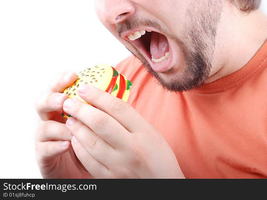 A young adult is about to eat a burger. A young adult is about to eat a burger