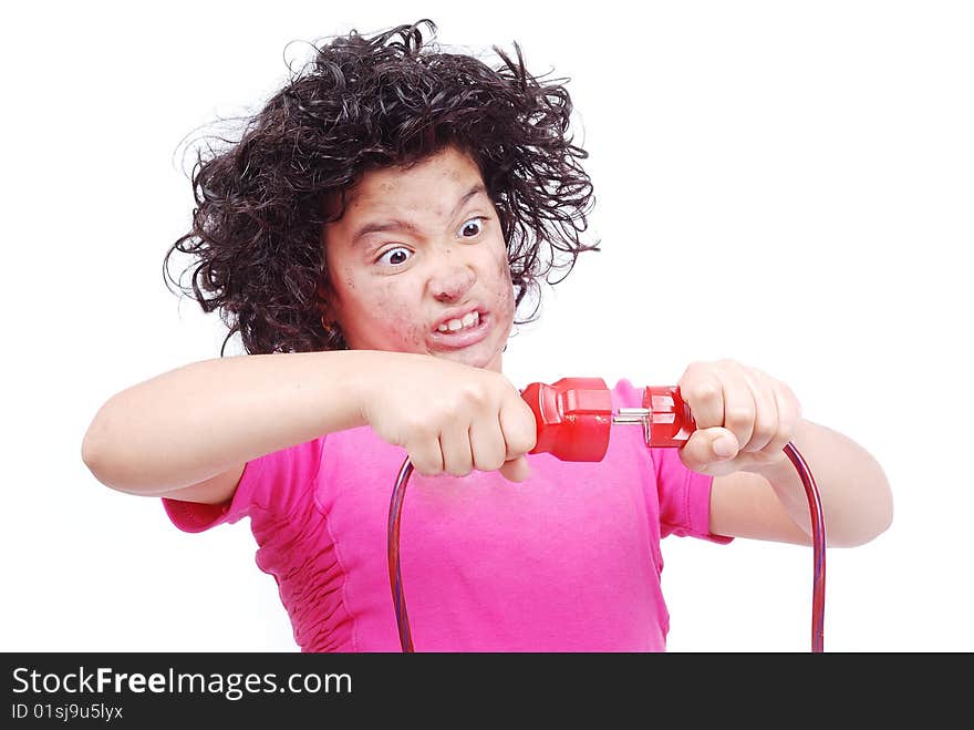 A cute girl is taking an electrical wire in hands. A cute girl is taking an electrical wire in hands