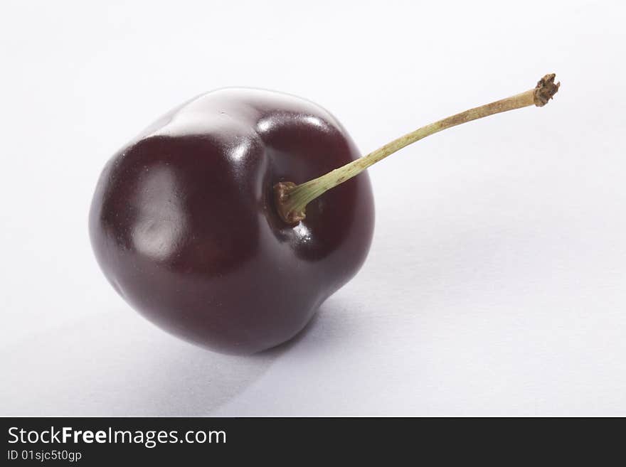 Close up of a cherry on a white background isolated.