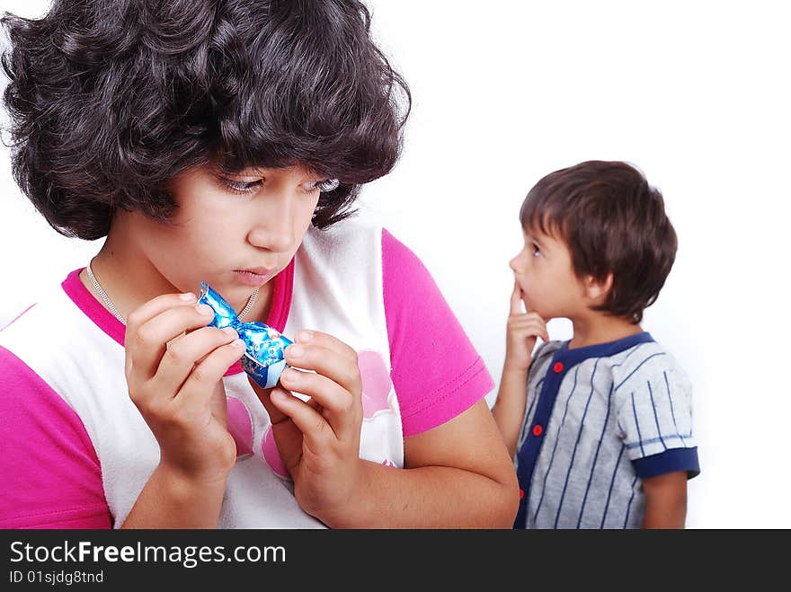 Girl is hiding a present from a boy