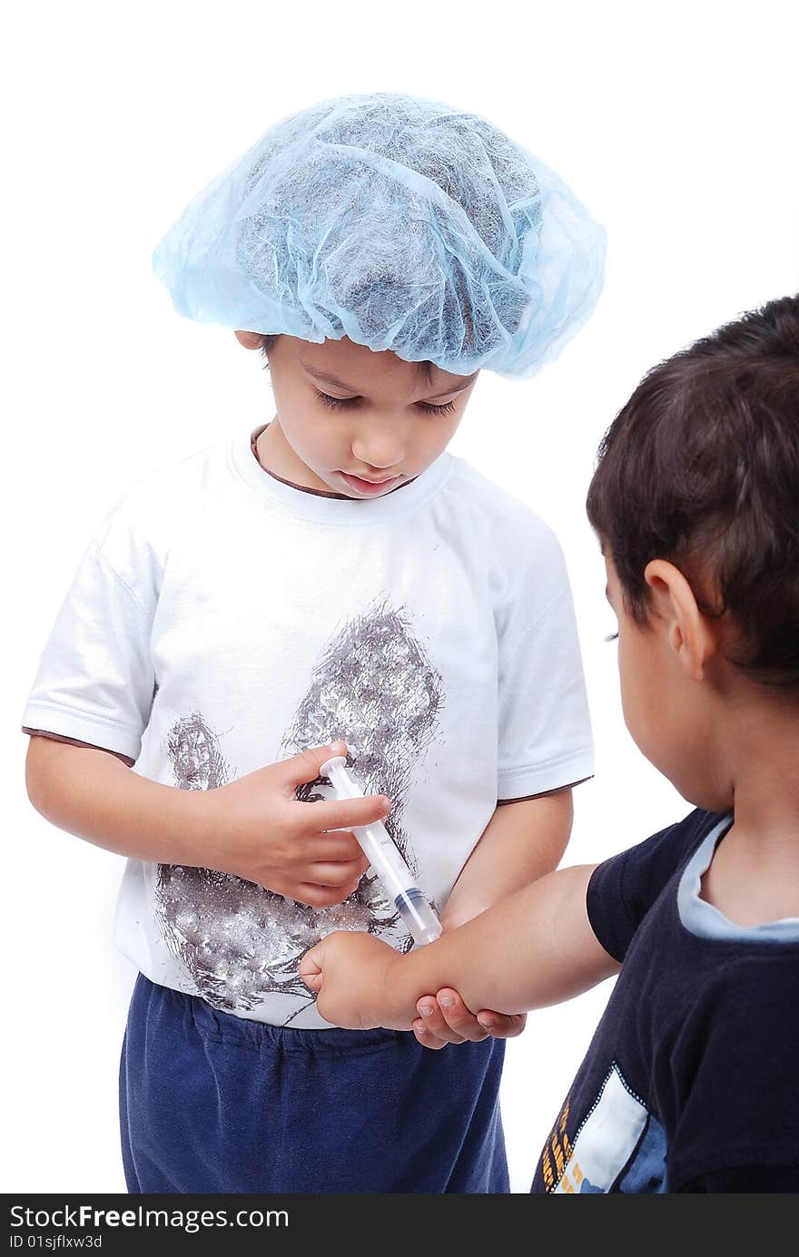 Two cute boys are playing as a doctors. Two cute boys are playing as a doctors