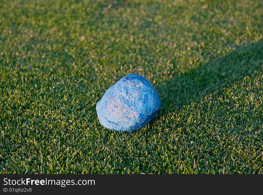 Blue stone in the middle of the grass. Blue stone in the middle of the grass