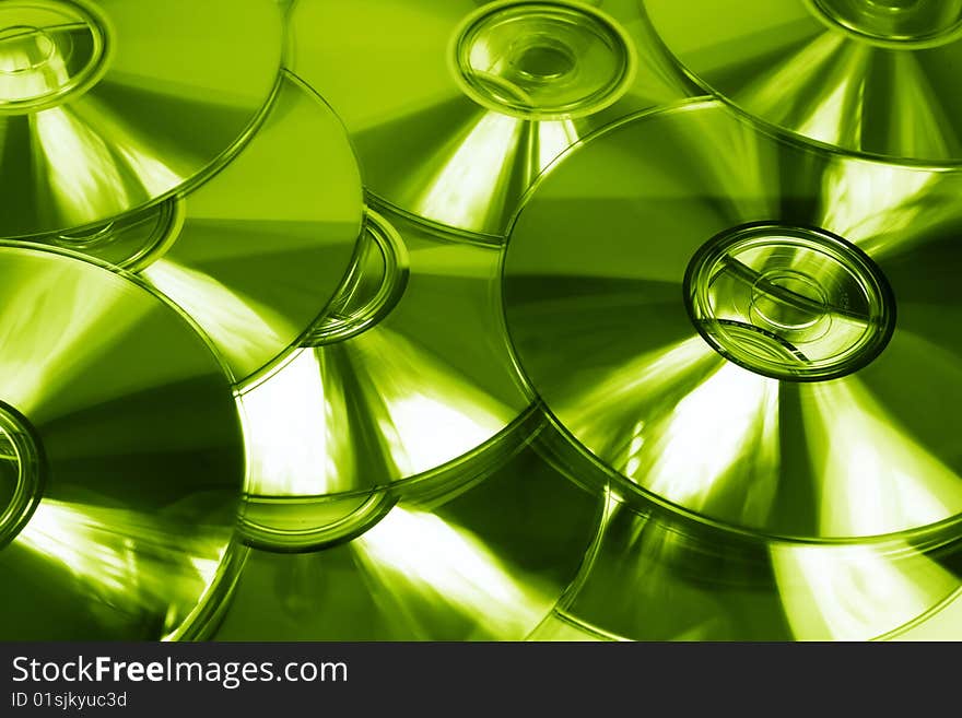 Lime green abstract background of cds. Lime green abstract background of cds.