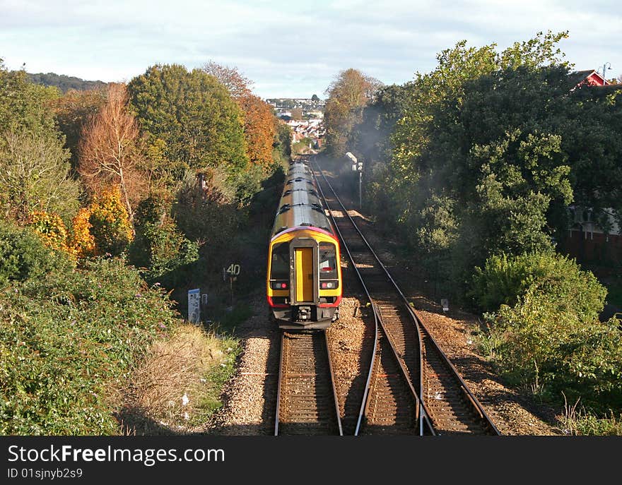 train on track between trees