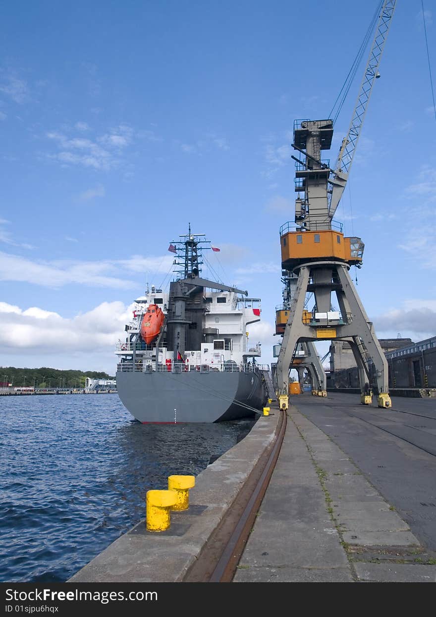 Cranes and a ship in port