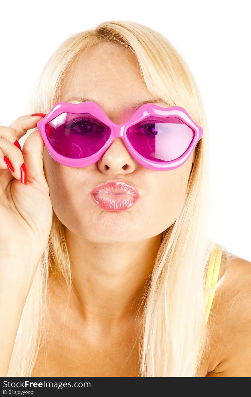 Pretty blonde woman in yellow bikini and rose sunglasses