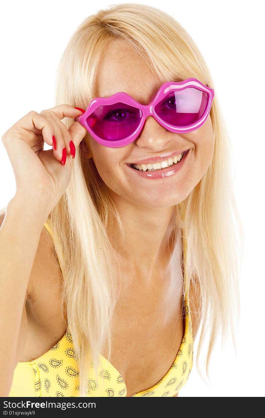 Pretty blonde  woman in yellow bikini and rose sunglasses