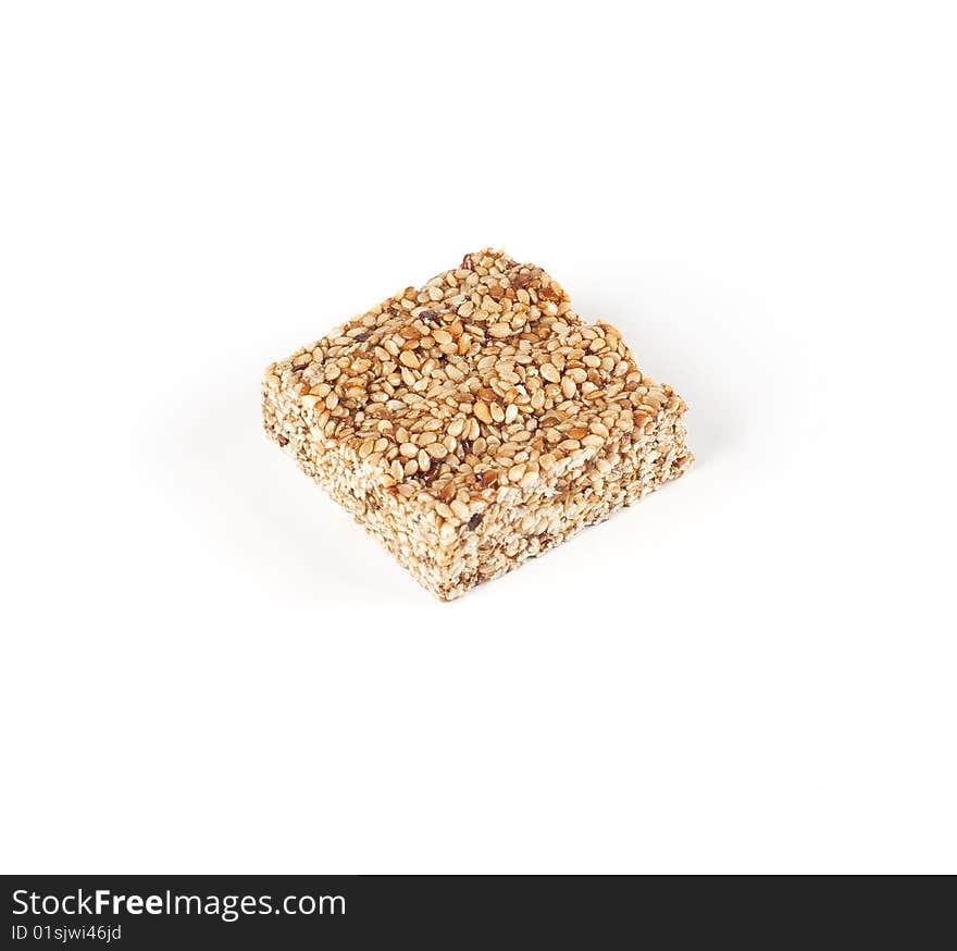 Sesame bar with honey on a white background