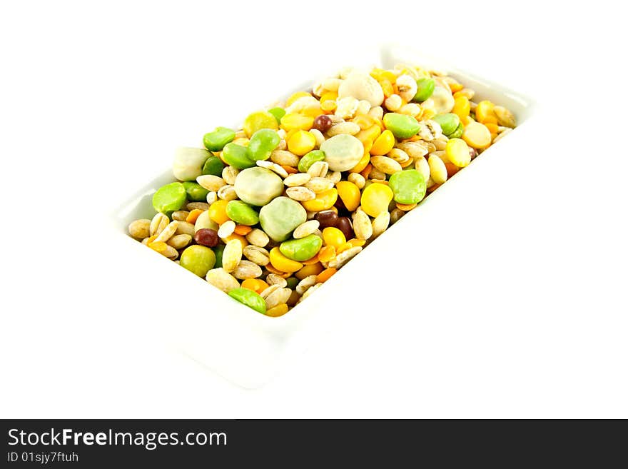 Assorted soup pulses in a dish with a white background