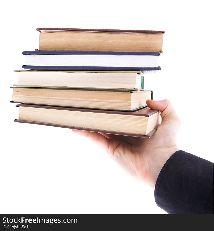 Isolated on a white background stack book on human palm.