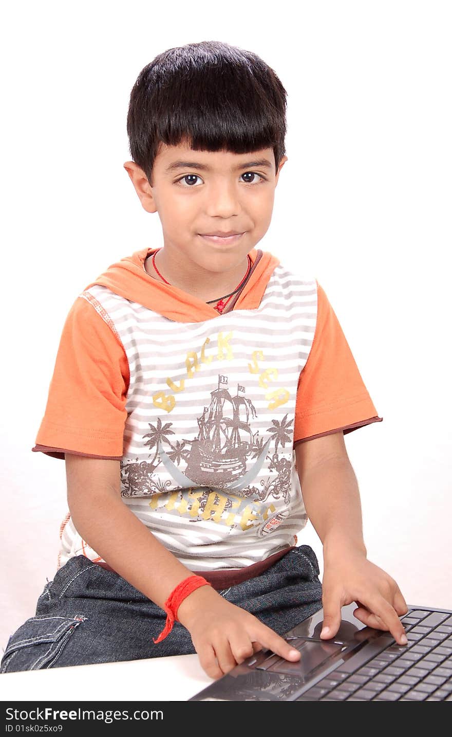 Boy with laptop isolated on a white background. Boy with laptop isolated on a white background