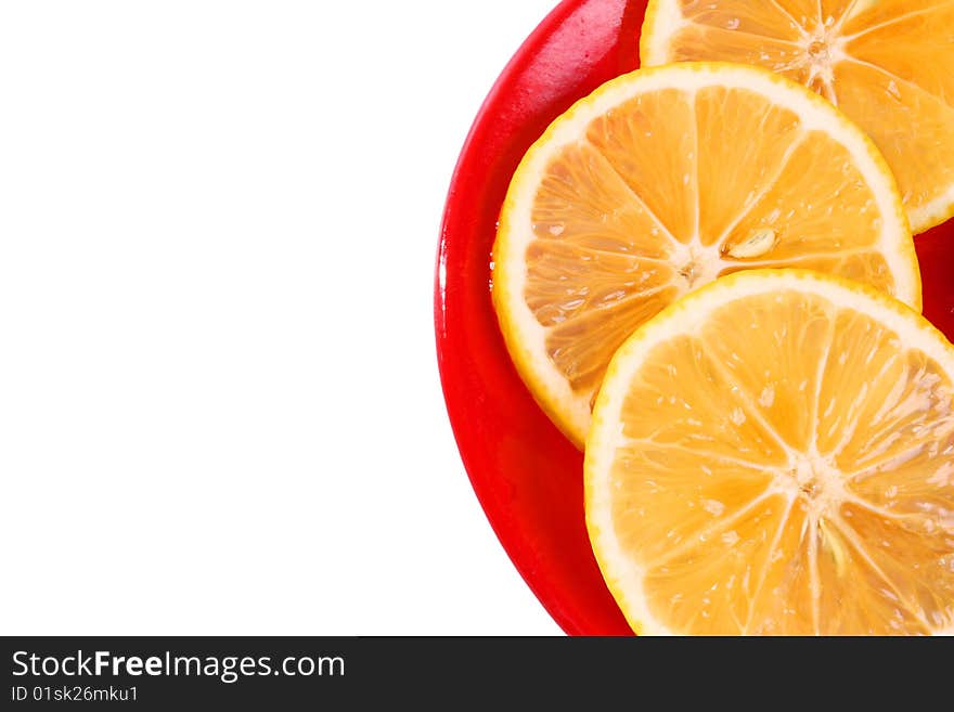 Three slice of orange on a red plate