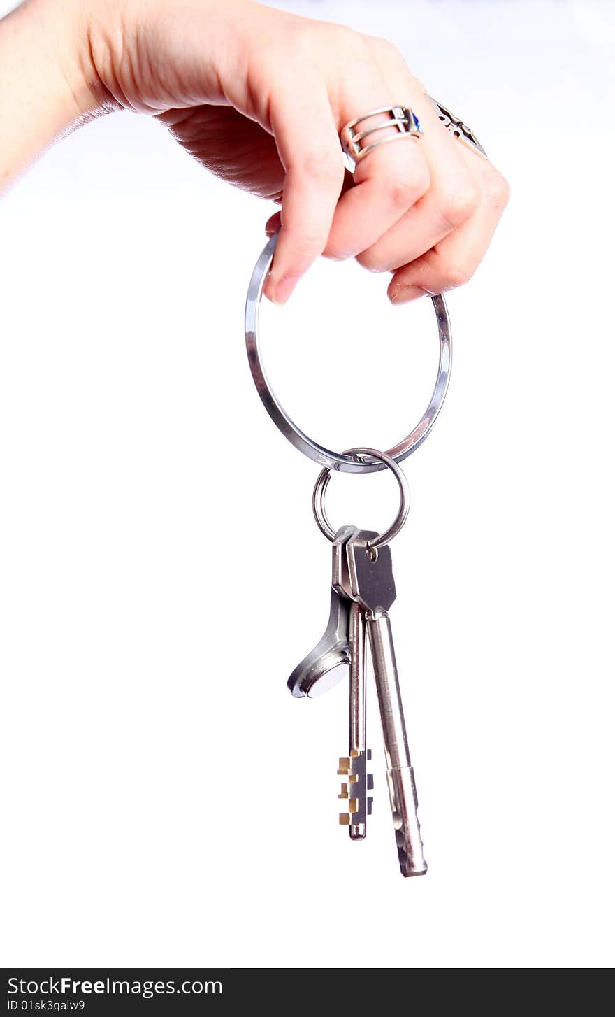 The big silver key in woman hand. The big silver key in woman hand