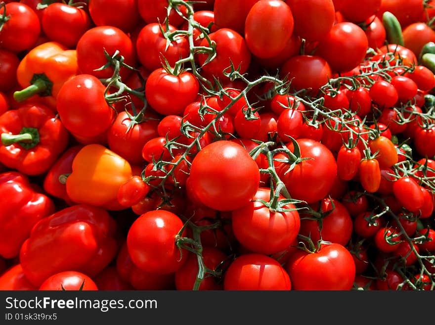 Different kinds of tomatos on a market. Different kinds of tomatos on a market