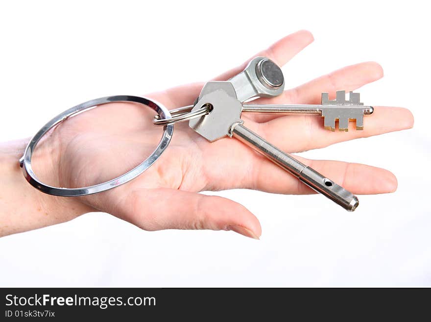 The big silver key in woman hand. The big silver key in woman hand