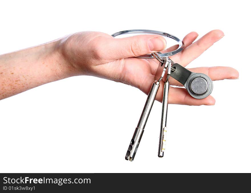 The big silver key in woman hand. The big silver key in woman hand