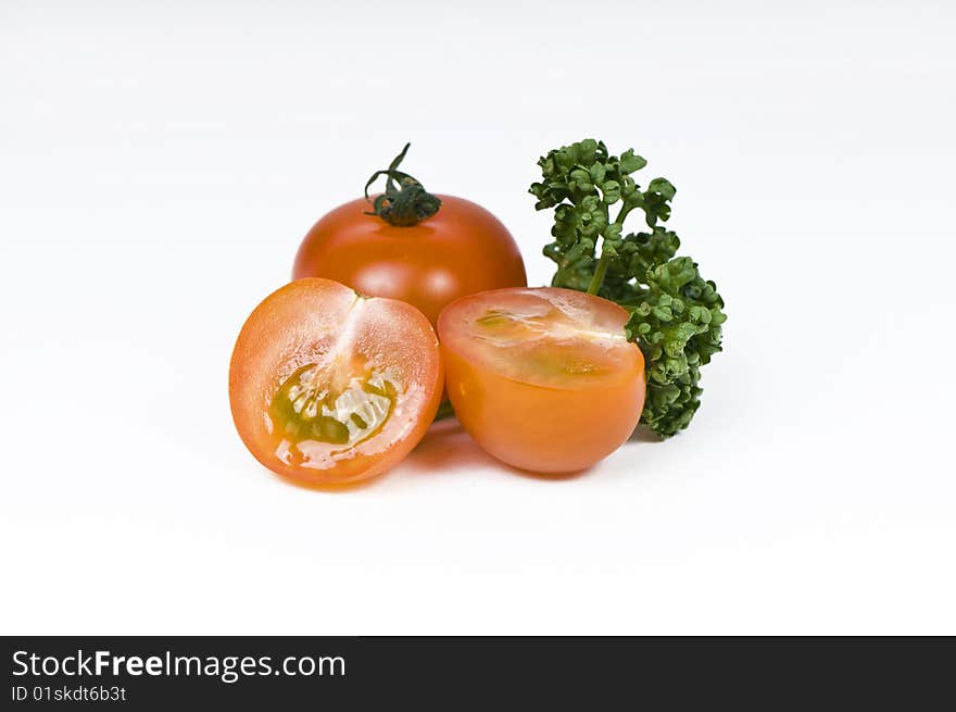 Cherry tomato and parsley on white background